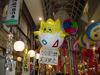 A giant Togepi figure promotes a shop at the festival.