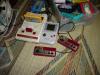 A shot of the Famicom, an old-style Game Boy, and both Famicom controllers.