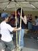 Bonnie tries her luck at the bamboo stilts with little success.