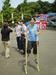 Joyce balances herself on bamboo stilts.