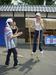 Lisa tries to balance herself on bamboo stilts.