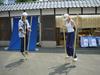 A worker demonstrates the bamboo stilts to Lisa.