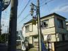 The little dolphin mascot adorns a light post that connects a surprisingly intricate series of phone, power, and television wires.
