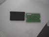 The back of a Game Boy Advance cartridge (left) and WonderSwan cartridge.