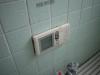 This remote control governs the shower and bath water temperature.