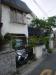 The front of the house, where the family stores three modes of transportation: a bike, a motor scooter, and the giant Nissan Elgrand minivan.