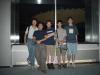 The five of us who visited the Tocho tower, with a reflection of the inside in the background.